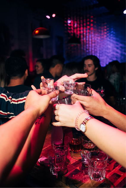 Friends cheersing at night